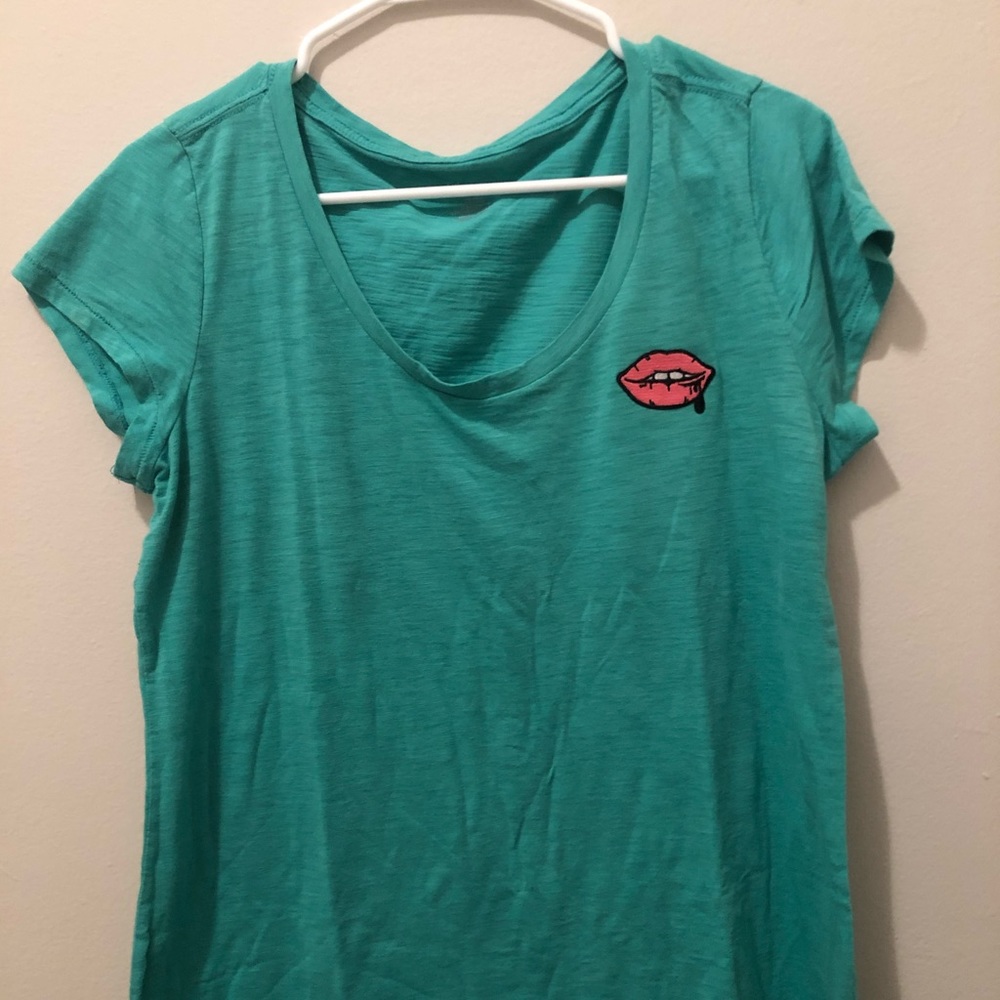 Tee with lip patch